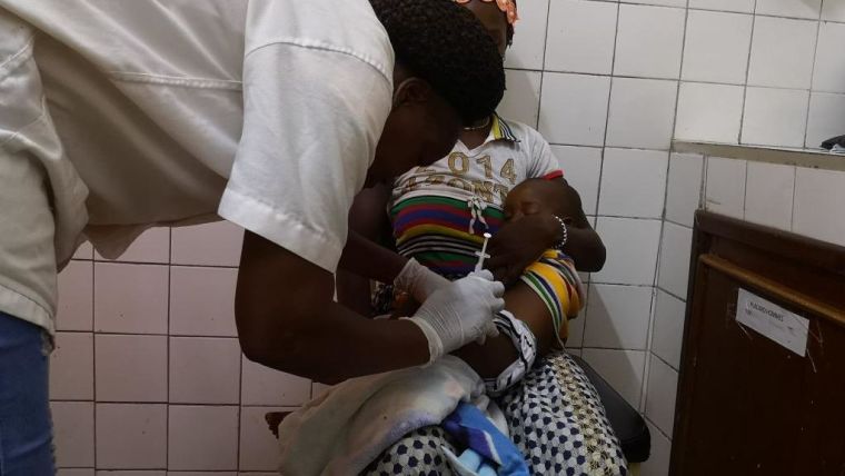 A child is vaccinated with the R21 malaria vaccine at Nanoro, Burkina Faso